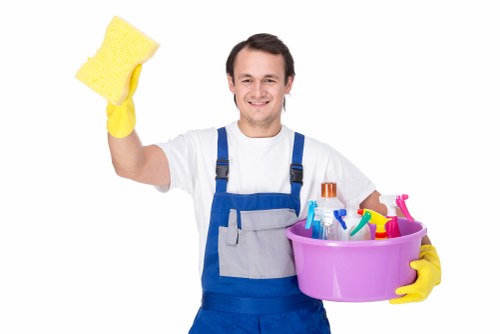 Cleaner using safe working practices in a professional cleaning environment